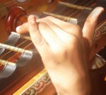 The scalloped fingerboard of a Veena